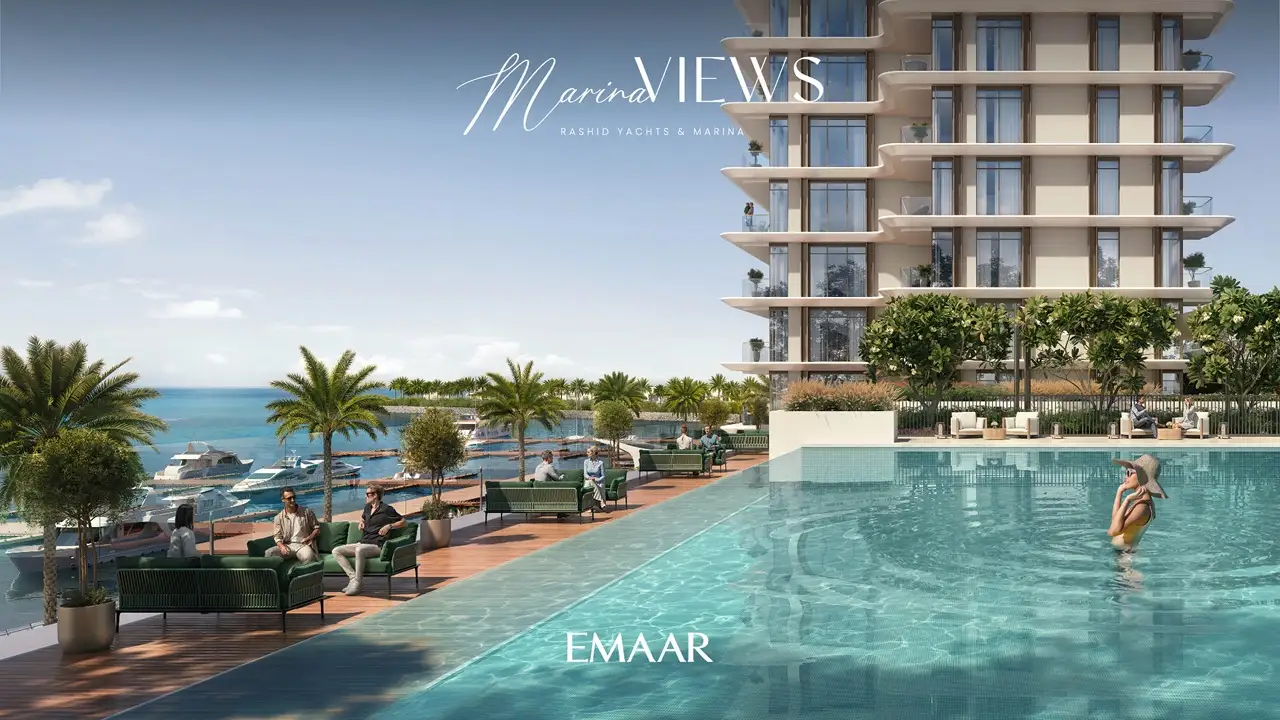 Marina Views at Rashid Yachts and Marina by Emaar infinity pool overlooking marina with yachts palm trees and waterfront seating in Dubai - Presented by Tohid Fetrat