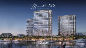 Marina Views at Rashid Yachts and Marina by Emaar waterfront residential towers illuminated at night with marina yachts and promenade in Dubai - Presented by Tohid Fetrat