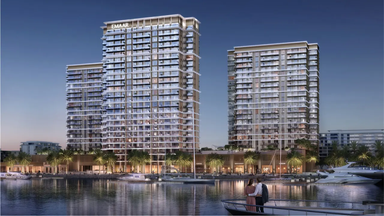 Marina Views at Rashid Yachts and Marina by Emaar waterfront residential towers with marina yachts and evening skyline in Dubai - Presented by Tohid Fetrat