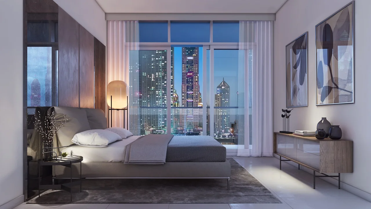 Marina Vista at Emaar Beachfront by Emaar bedroom interior with floor to ceiling windows and night skyline view in Dubai - Presented by Tohid Fetrat