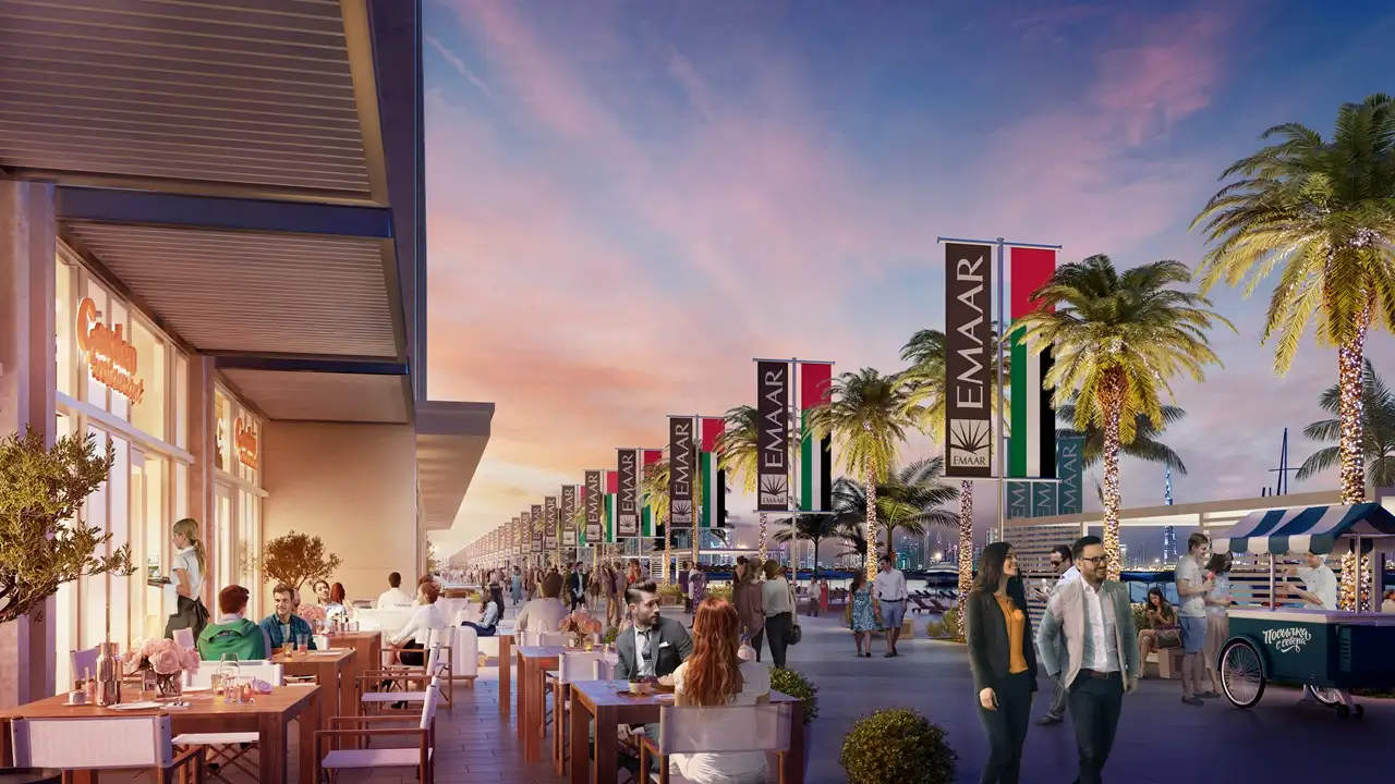 Marina Vista at Emaar Beachfront by Emaar waterfront promenade with outdoor dining cafes palm trees and retail spaces in Dubai - Presented by Tohid Fetrat
