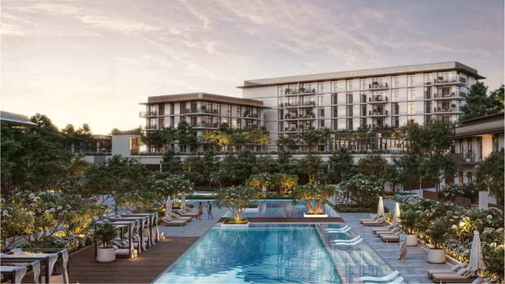 Ocean Star at Rashid Yachts & Marina by Emaar central swimming pool with sun loungers landscaped gardens and residential buildings in Dubai - Presented by Tohid Fetrat