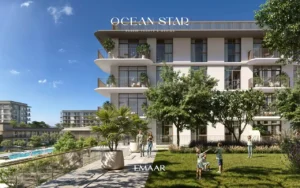 Ocean Star at Rashid Yachts & Marina by Emaar landscaped garden with families and modern apartment building facade in Dubai - Presented by Tohid Fetrat