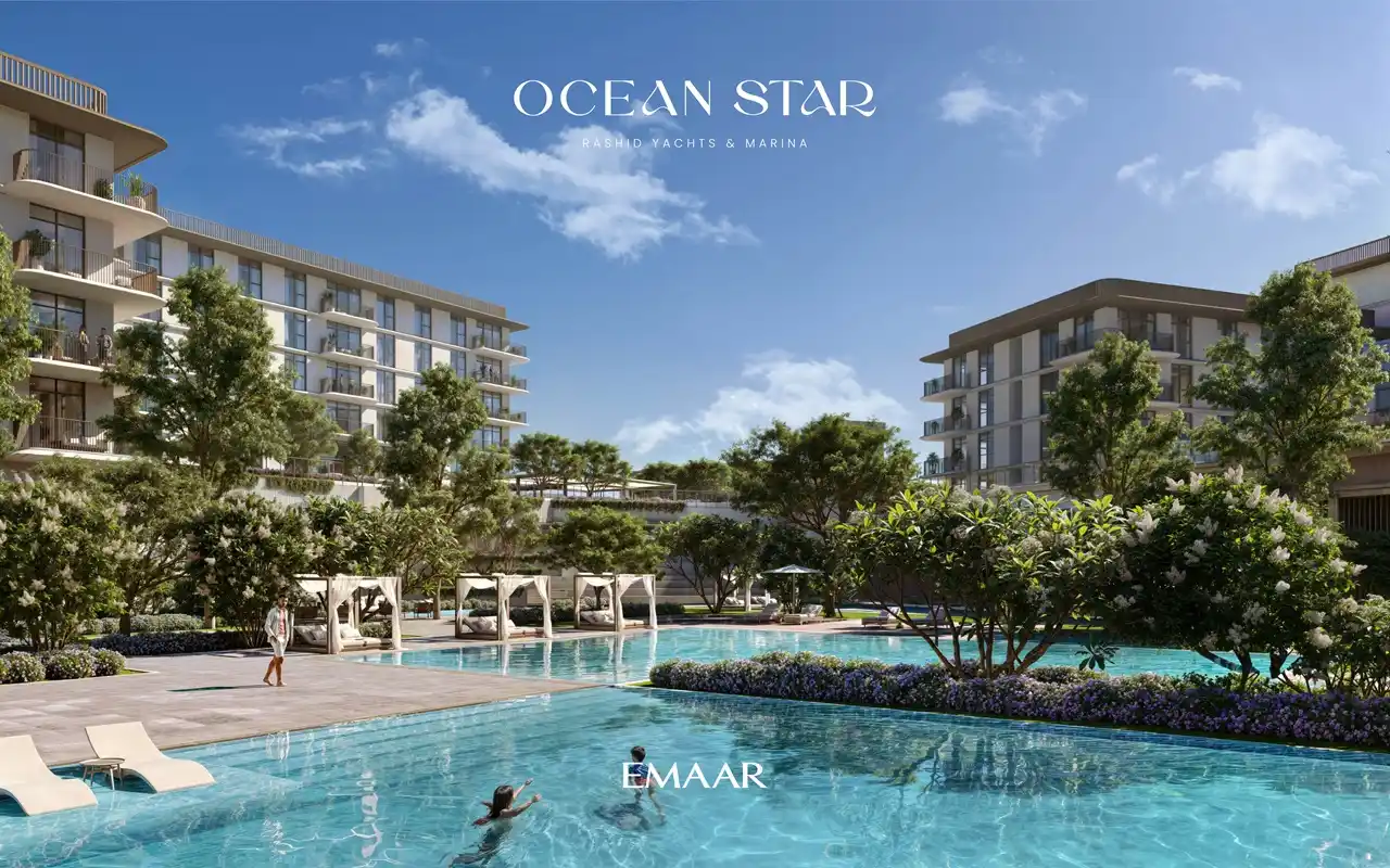 Ocean Star at Rashid Yachts & Marina by Emaar swimming pool with landscaped gardens shaded cabanas and residential buildings in Dubai - Presented by Tohid Fetrat