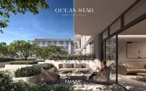 Ocean Star at Rashid Yachts & Marina by Emaar private terrace seating area with landscaped garden and modern apartment facade in Dubai - Presented by Tohid Fetrat