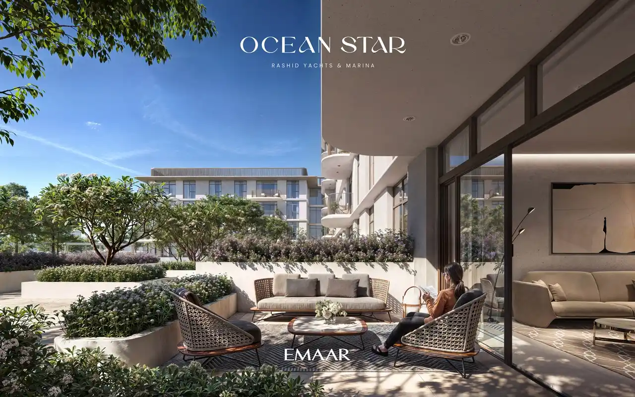 Ocean Star at Rashid Yachts & Marina by Emaar private terrace seating area with landscaped garden and modern apartment facade in Dubai - Presented by Tohid Fetrat
