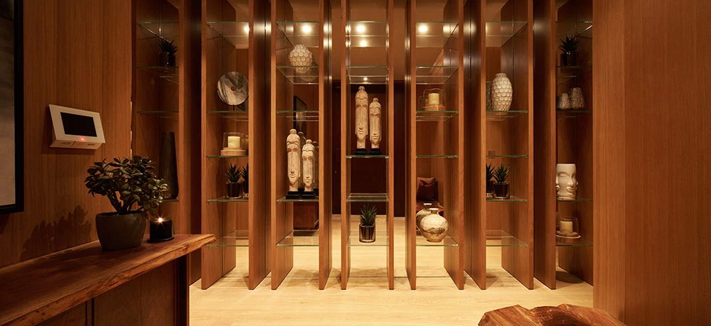 One at Palm Jumeirah Dorchester Collection by Omniyat decorative display lounge with wooden panels and curated art pieces in Dubai - Presented by Tohid Fetrat