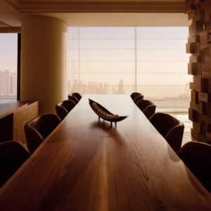 One at Palm Jumeirah Dorchester Collection by Omniyat dining room with long wooden table and skyline view in Dubai - Presented by Tohid Fetrat