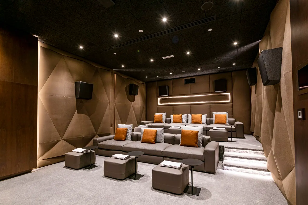 One at Palm Jumeirah Dorchester Collection by Omniyat private cinema room with plush seating and acoustic wall panels in Dubai - Presented by Tohid Fetrat