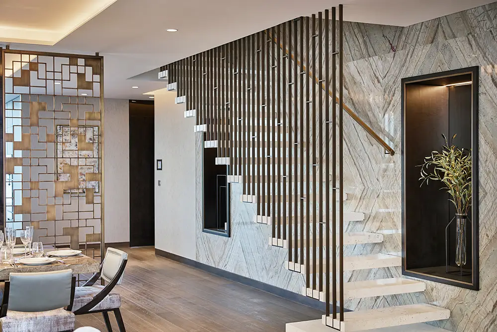 One at Palm Jumeirah Dorchester Collection by Omniyat staircase with vertical partition and marble wall design in Dubai - Presented by Tohid Fetrat