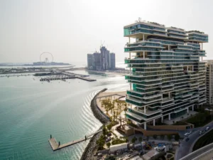One at Palm Jumeirah Dorchester Collection by Omniyat waterfront building with layered architecture and marina views in Dubai - Presented by Tohid Fetrat