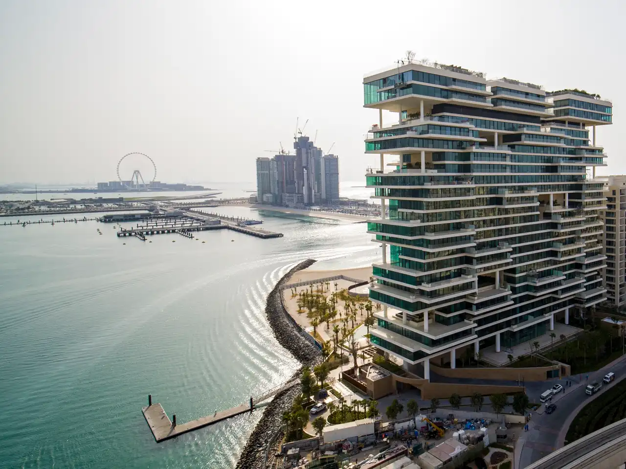 One at Palm Jumeirah Dorchester Collection by Omniyat waterfront building with layered architecture and marina views in Dubai - Presented by Tohid Fetrat