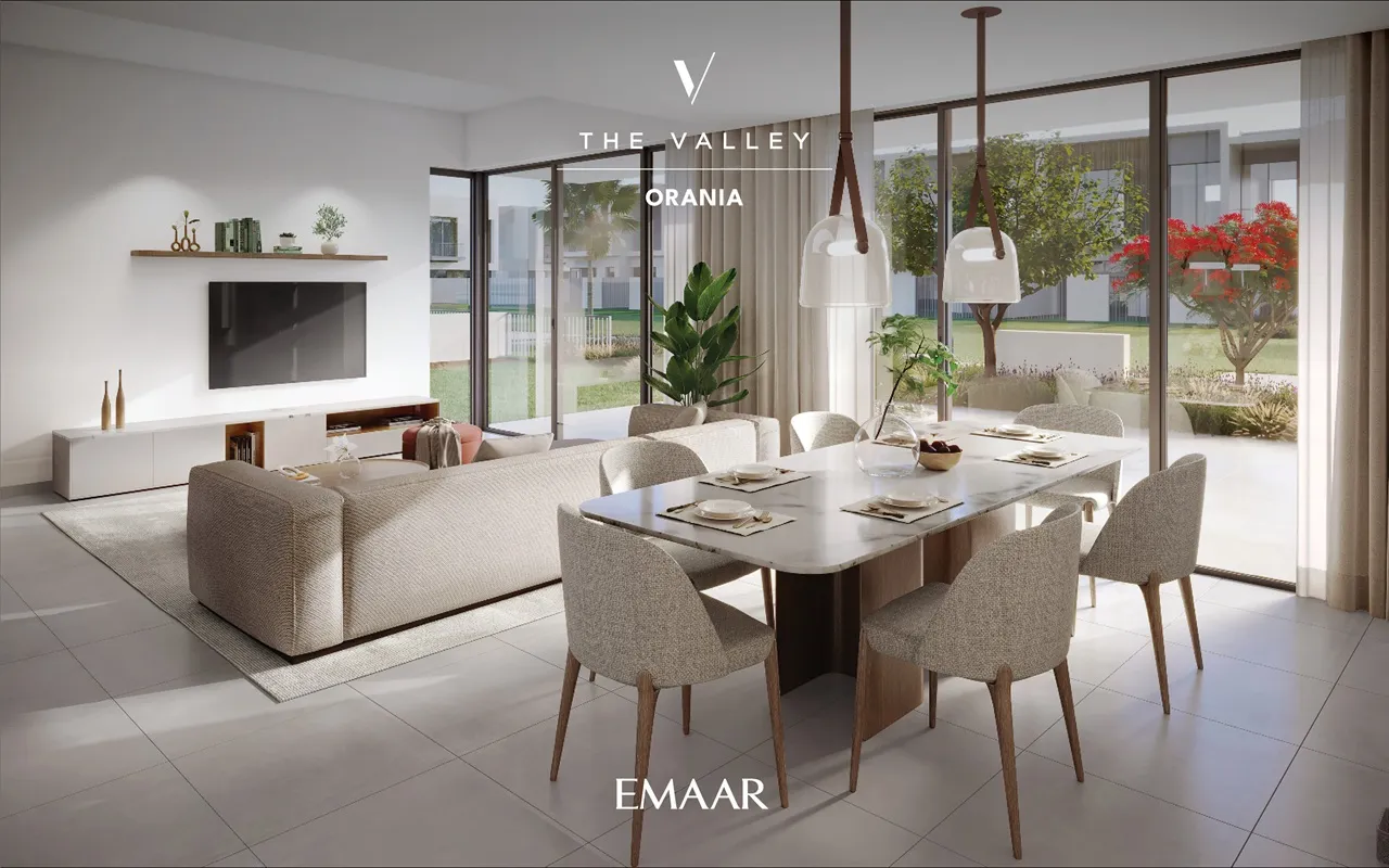 Orania at The Valley by Emaar living and dining space with modern furniture large glass doors and garden view in Dubai - Presented by Tohid Fetrat