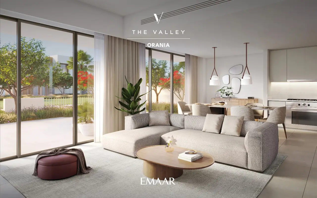 Orania at The Valley by Emaar living room interior with modern sofa large glass doors and garden view in Dubai - Presented by Tohid Fetrat