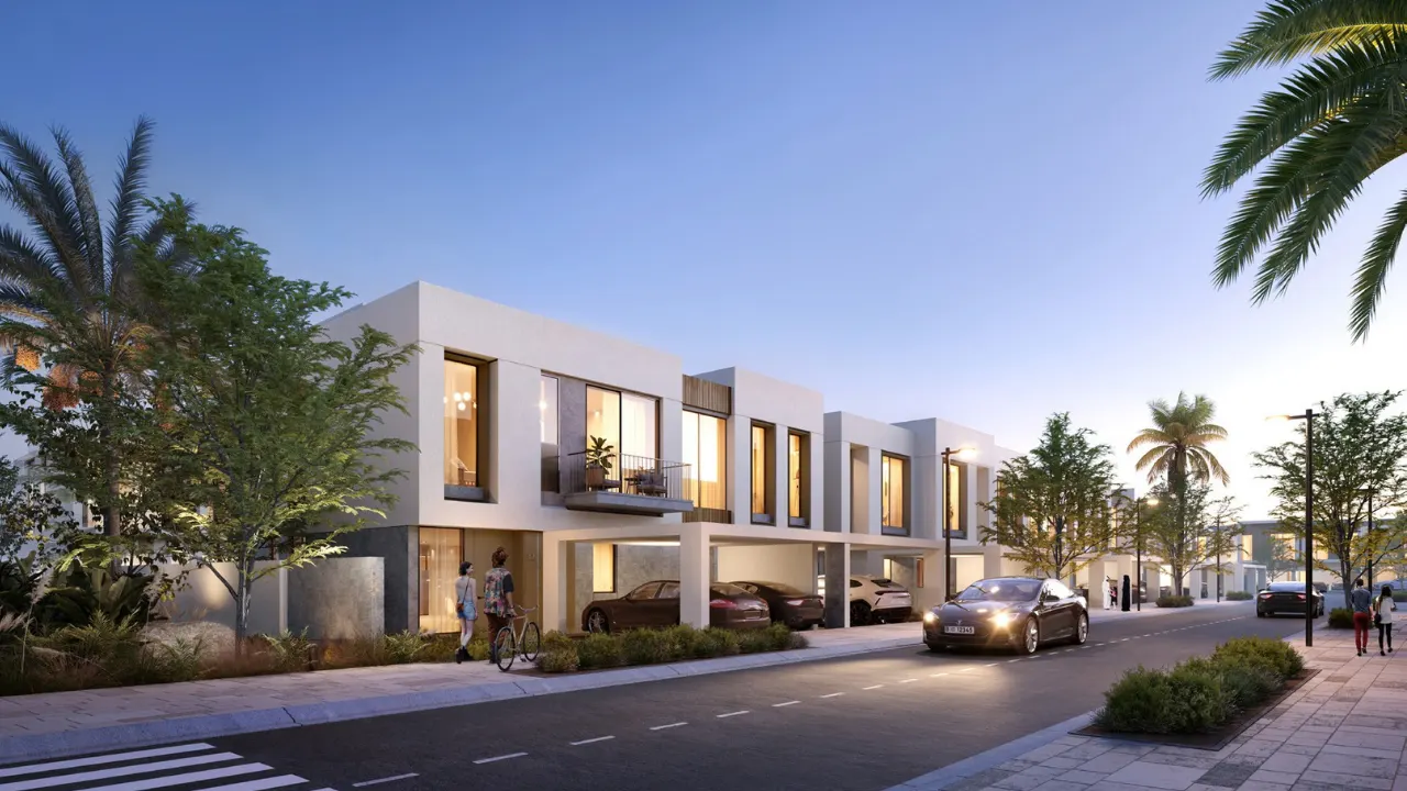 Orania at The Valley by Emaar townhouse street view in evening with modern facades lighting and landscaped sidewalks in Dubai - Presented by Tohid Fetrat