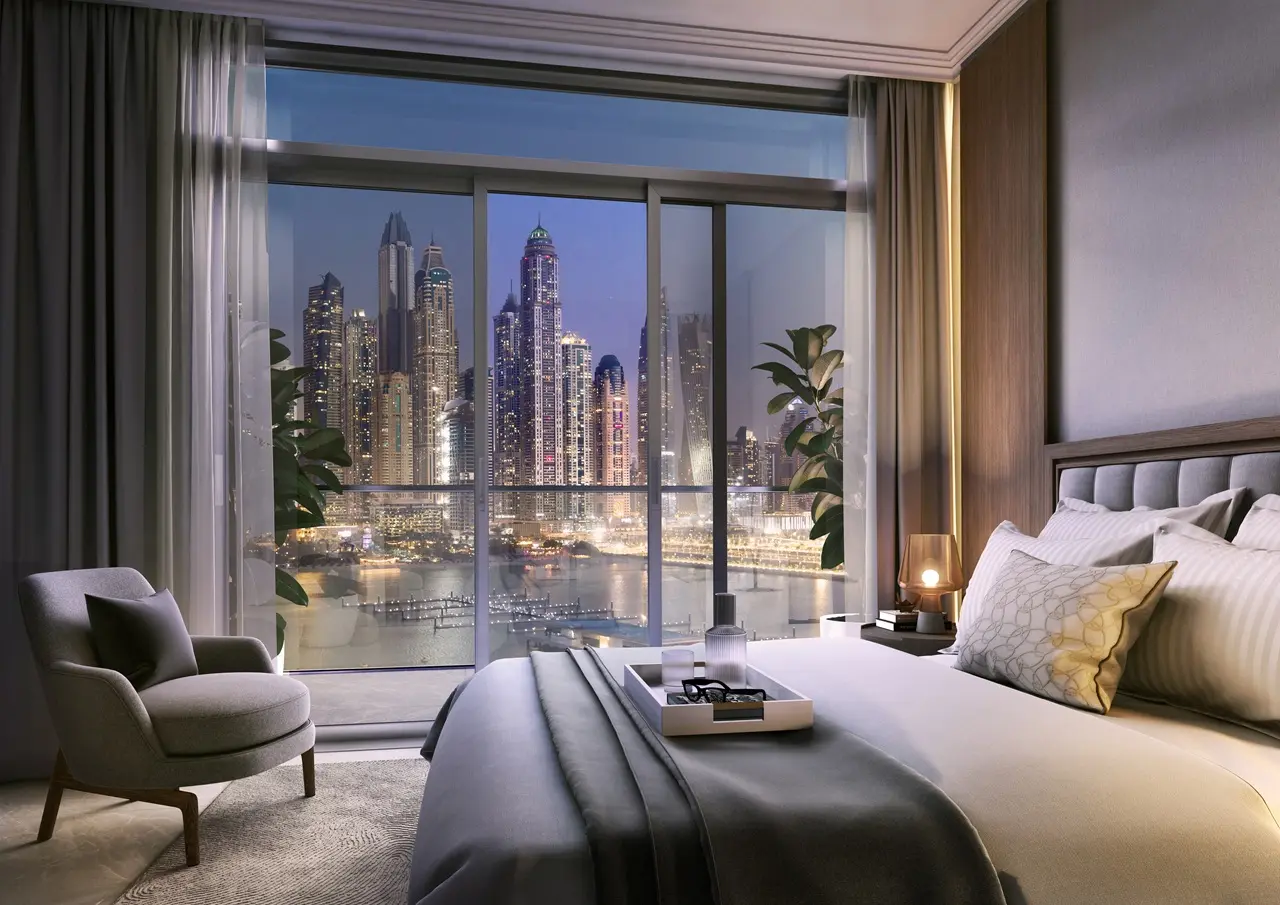 Palace Beach Residence at Emaar Beachfront by Emaar bedroom with floor to ceiling windows and marina skyline night view in Dubai - Presented by Tohid Fetrat
