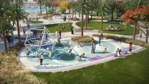 Palace Beach Residence at Emaar Beachfront by Emaar landscaped park with children playground palm trees and waterfront setting in Dubai - Presented by Tohid Fetrat