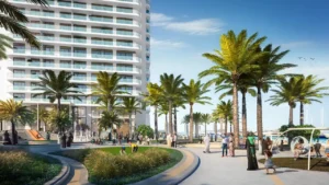 Palace Beach Residence at Emaar Beachfront by Emaar waterfront promenade with palm trees landscaped walkways and residential tower in Dubai - Presented by Tohid Fetrat