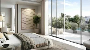 Palmiera at The Oasis by Emaar bedroom interior with floor to ceiling windows and terrace view overlooking greenery in Dubai - Presented by Tohid Fetrat