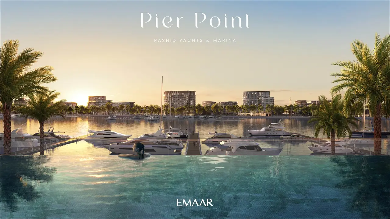 Pier Point 1 at Rashid Yachts & Marina by Emaar infinity pool at sunset overlooking marina with yachts in Dubai - Presented by Tohid Fetrat