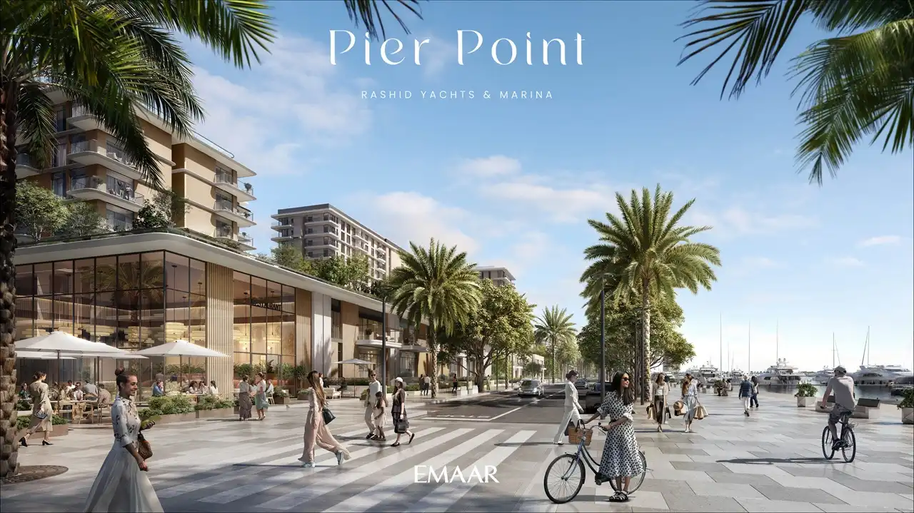Pier Point 2 at Rashid Yachts & Marina by Emaar waterfront promenade with retail cafes pedestrians bicycles palm trees and marina setting in Dubai - Presented by Tohid Fetrat
