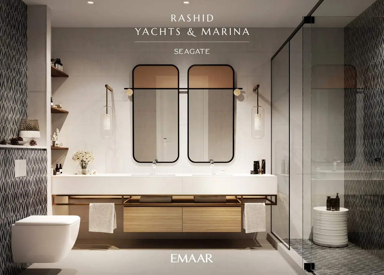 Seagate at Rashid Yachts & Marina by Emaar modern bathroom interior with double vanity mirrors glass shower and elegant finishes in Dubai - Presented by Tohid Fetrat