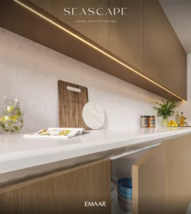 Seascape at Rashid Yachts & Marina by Emaar modern kitchen detail with wooden cabinetry countertop lighting and decor elements in Dubai - Presented by Tohid Fetrat