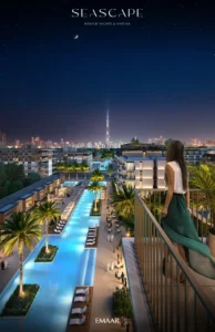 Seascape at Rashid Yachts & Marina by Emaar night view of illuminated pool promenade palm trees and city skyline in Dubai - Presented by Tohid Fetrat