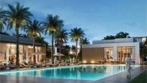 Selvara at Grand Polo Club & Resort by Emaar luxury community pool with palm trees, sun loungers, ambient lighting, and modern villas in Dubai Presented by Tohid Fetrat