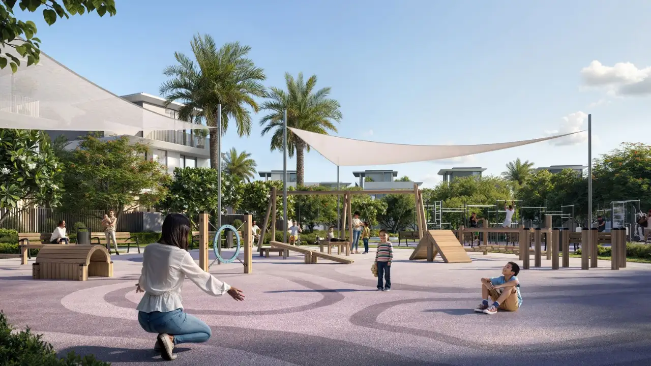 Selvara at Grand Polo Club & Resort by Emaar outdoor kids play area with shaded seating, activity structures, landscaped surroundings, and family friendly setting in Dubai Presented by Tohid Fetrat