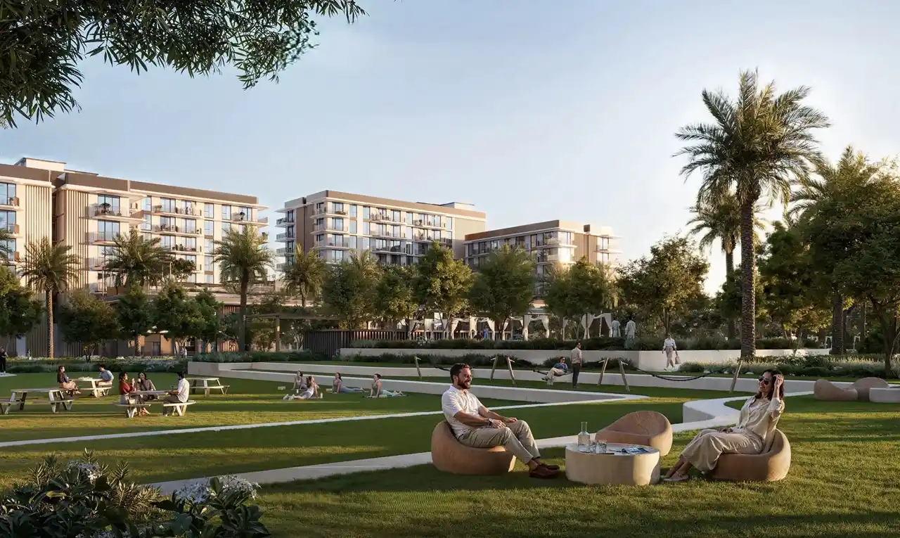 Sera 1 at Rashid Yachts & Marina by Emaar landscaped community park with green lawns seating areas palm trees and residential buildings in Dubai - Presented by Tohid Fetrat