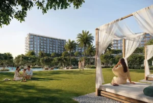 Sera 1 at Rashid Yachts & Marina by Emaar landscaped garden with cabana seating green lawn palm trees and residential buildings in Dubai - Presented by Tohid Fetrat