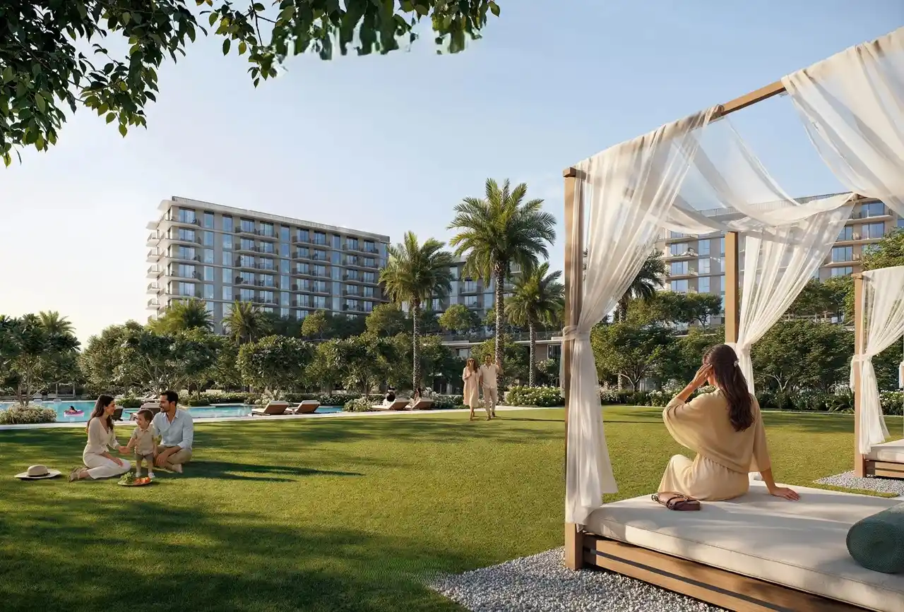 Sera 1 at Rashid Yachts & Marina by Emaar landscaped garden with cabana seating green lawn palm trees and residential buildings in Dubai - Presented by Tohid Fetrat