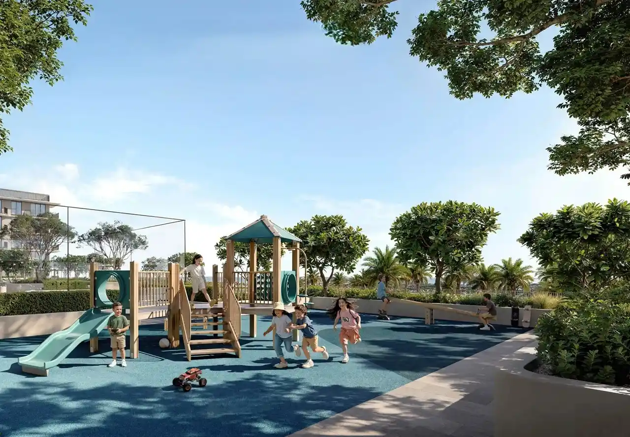 Sera 1 at Rashid Yachts & Marina by Emaar outdoor kids playground with slides climbing structure and landscaped green surroundings in Dubai - Presented by Tohid Fetrat