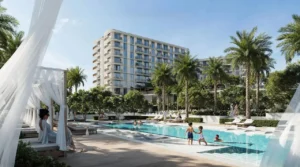 Sera 1 at Rashid Yachts & Marina by Emaar resort style swimming pool with cabanas sun loungers palm trees and residential buildings in Dubai - Presented by Tohid Fetrat