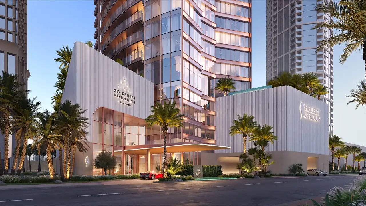Six Senses Residences Dubai Marina by Select Group main entrance with modern facade palm landscaping and drop off area in Dubai - Presented by Tohid Fetrat