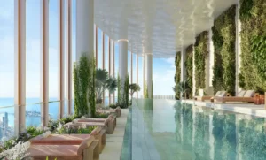 Six Senses Residences Dubai Marina by Select Group skydeck infinity pool with lounge beds greenery and Gulf views in Dubai - Presented by Tohid Fetrat