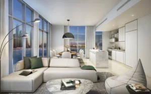 Sunrise Bay at Emaar Beachfront by Emaar open kitchen living and dining area with sunset marina view floor to ceiling windows and modern interior in Dubai - Presented by Tohid Fetrat