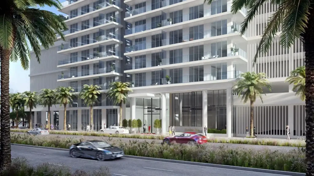 Sunrise Bay at Emaar Beachfront by Emaar podium level entrance with glass facade palm lined street and modern residential exterior in Dubai - Presented by Tohid Fetrat