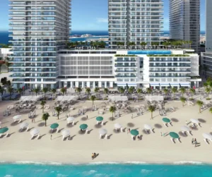 Sunrise Bay at Emaar Beachfront by Emaar beachfront podium with infinity pool sun loungers and modern residential towers overlooking the Gulf in Dubai - Presented by Tohid Fetrat