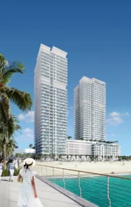 Sunrise Bay at Emaar Beachfront by Emaar twin residential towers viewed from seaside promenade with sandy beach and Gulf waters in Dubai - Presented by Tohid Fetrat