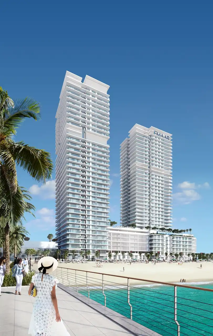Sunrise Bay at Emaar Beachfront by Emaar twin residential towers viewed from seaside promenade with sandy beach and Gulf waters in Dubai - Presented by Tohid Fetrat