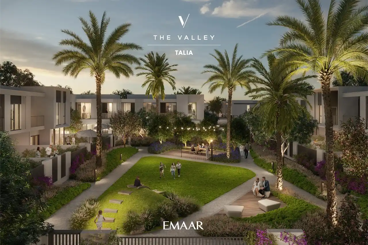 TALIA at The Valley by Emaar landscaped community garden with palm trees evening lighting and social seating areas in Dubai - Presented by Tohid Fetrat