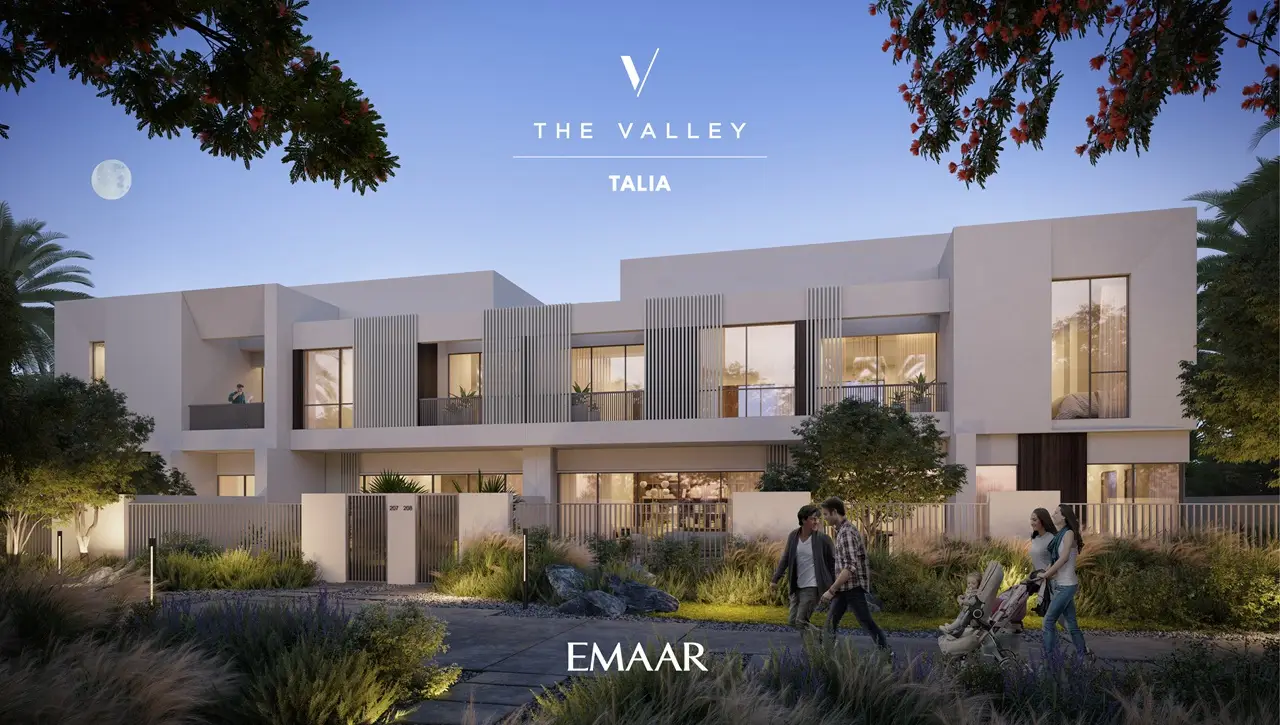 TALIA at The Valley by Emaar modern townhouse facade with evening lighting landscaped gardens and pedestrian pathway in Dubai - Presented by Tohid Fetrat