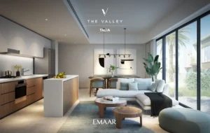 TALIA at The Valley by Emaar open plan kitchen and living area with modern finishes island counter and large windows in Dubai - Presented by Tohid Fetrat