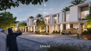 TALIA at The Valley by Emaar townhouse street view with modern facades evening lighting landscaped greenery and parked cars in Dubai - Presented by Tohid Fetrat