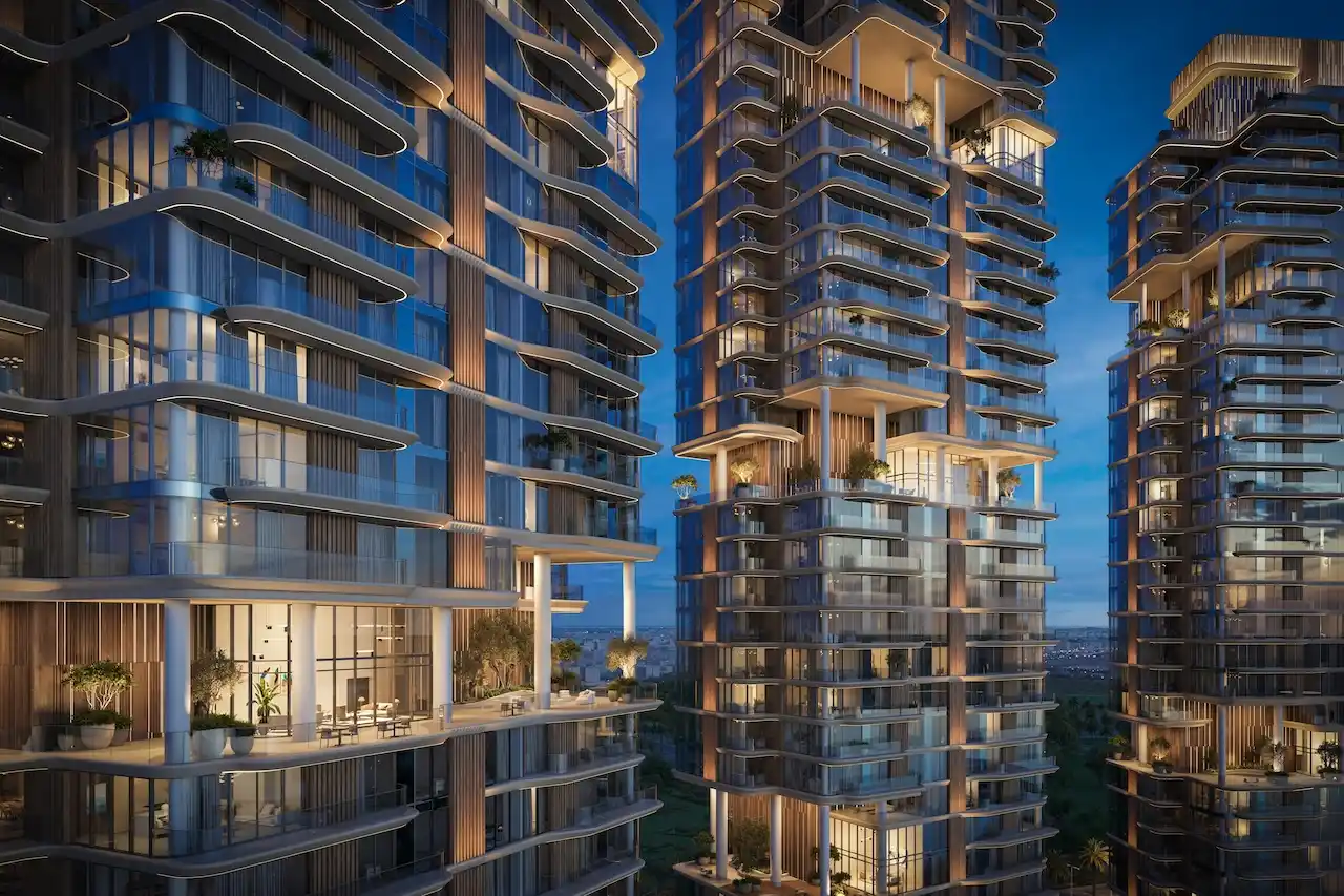 The Edit at d3 construction update showing modern residential towers with illuminated balconies and exterior facade details in Dubai Presented by Tohid Fetrat