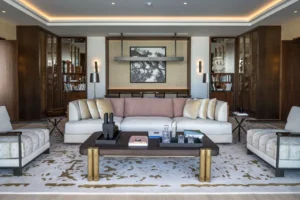 The Lana Residences Dorchester Collection by Omniyat 2 bedroom living area with elegant sofa and refined interior styling in Dubai - Presented by Tohid Fetrat