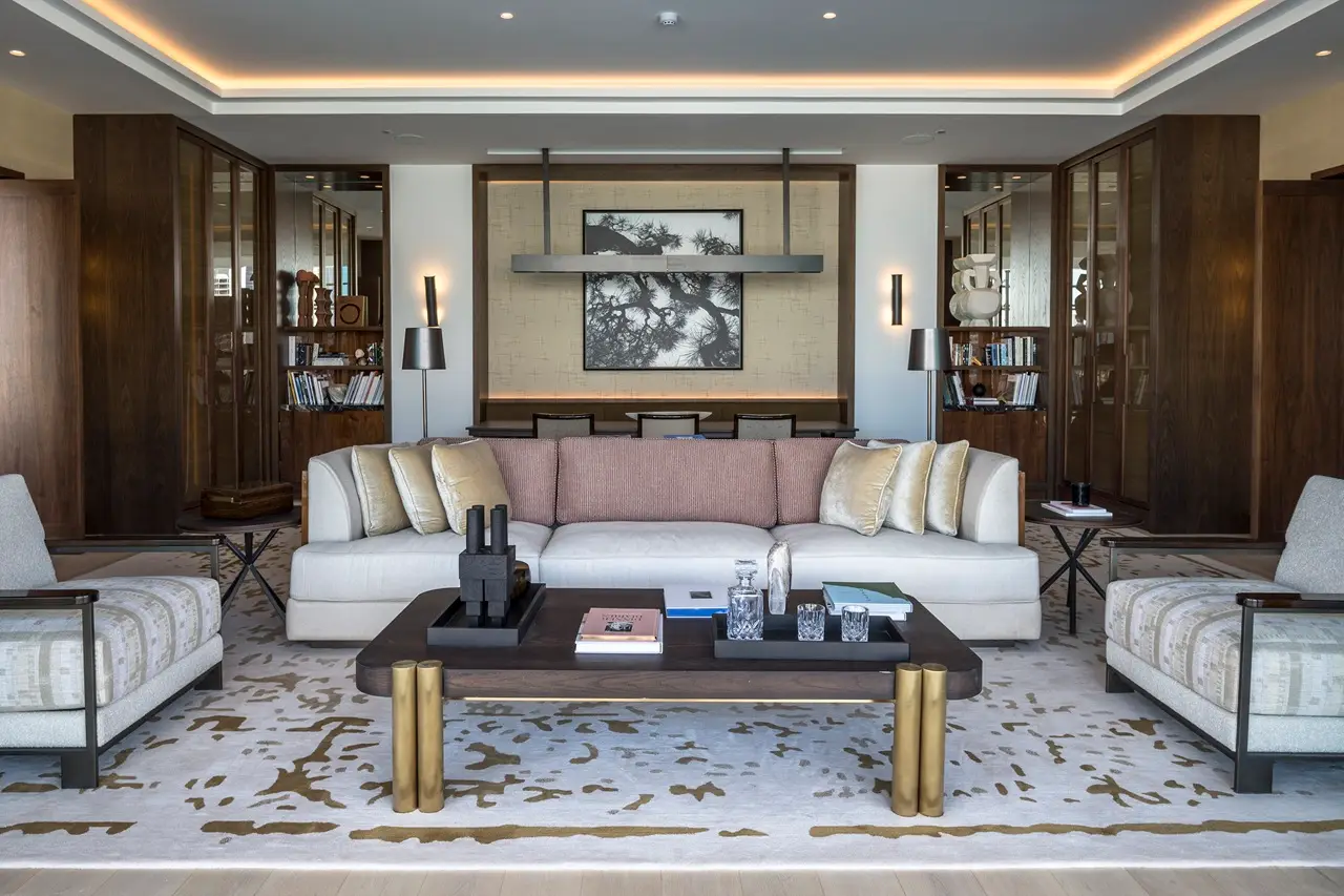 The Lana Residences Dorchester Collection by Omniyat 2 bedroom living area with elegant sofa and refined interior styling in Dubai - Presented by Tohid Fetrat