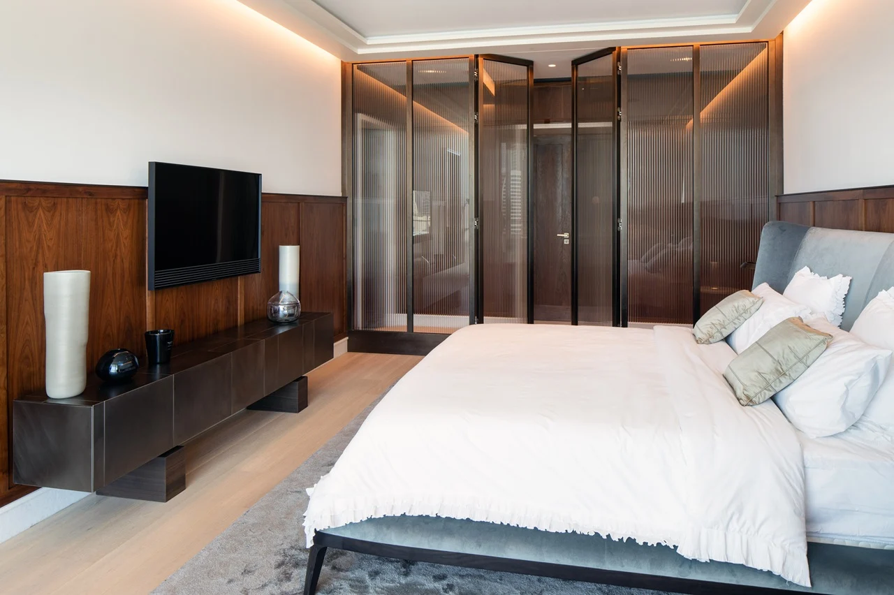 The Lana Residences Dorchester Collection by Omniyat 4 bedroom duplex bedroom with built in wardrobe modern wood finishes and elegant interior design in Dubai - Presented by Tohid Fetrat